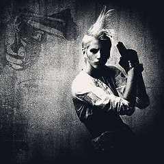 Image showing acttractive blond girl with gun