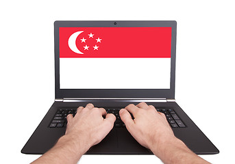 Image showing Hands working on laptop, Singapore