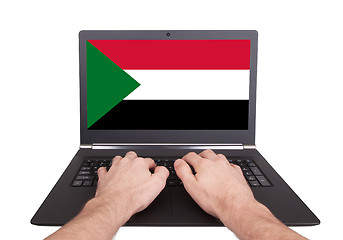 Image showing Hands working on laptop, Sudan