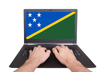 Image showing Hands working on laptop, Solomon Islands