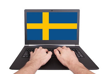 Image showing Hands working on laptop, Sweden