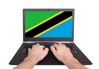 Image showing Hands working on laptop, Tanzania