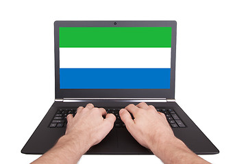 Image showing Hands working on laptop, Sierra Leone