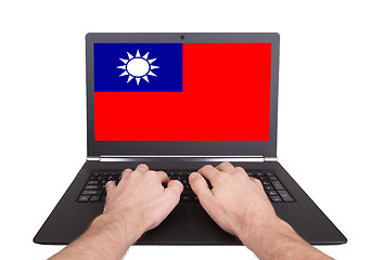 Image showing Hands working on laptop, Taiwan