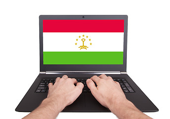 Image showing Hands working on laptop, Tajikistan