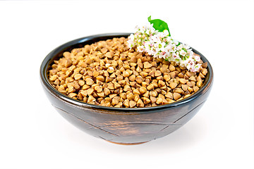 Image showing Buckwheat in brown bowl and flower