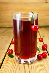 Image showing Compote cherry in tall glass on board