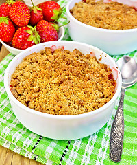 Image showing Crumble strawberry on green napkin with berries