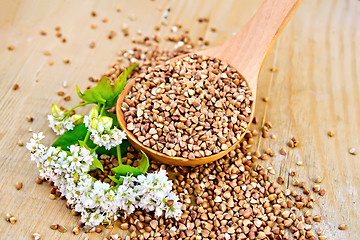 Image showing Buckwheat in spoon on board with flower