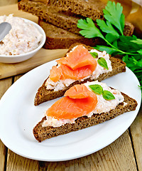 Image showing Sandwiches on pieces of bread with salmon and cream