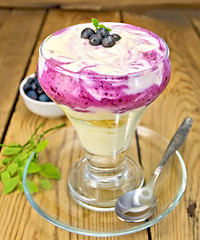 Image showing Dessert milk with blueberries in glassware on board