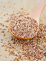 Image showing Buckwheat with spoon on wooden board