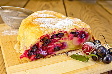 Image showing Strudel berry with strainer on board