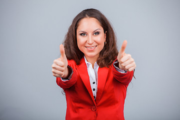 Image showing Young attractive girl in red with folders