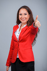 Image showing Young attractive girl in red with folders