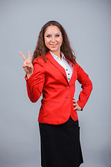 Image showing Young attractive girl in red with folders