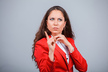 Image showing Young attractive girl in red with folders