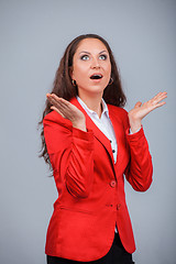 Image showing Young attractive girl in red with folders