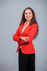 Image showing Young attractive girl in red with folders