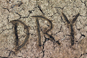 Image showing The word dry. Closeup of dry soil