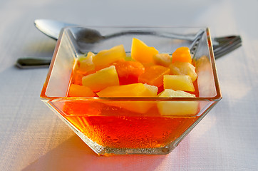 Image showing Dessert: fruit pieces in a sugar syrup.