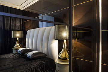 Image showing Interior bedroom bed and table lamps