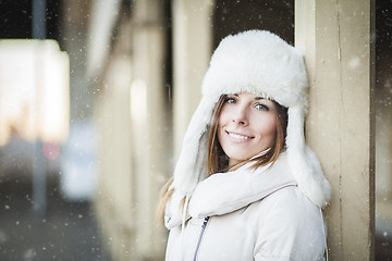 Image showing Smiling young woman in blizzard