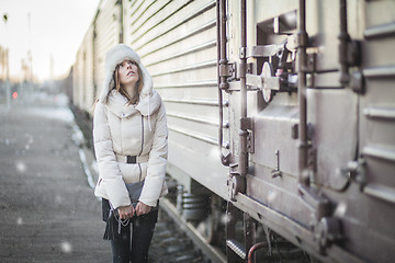 Image showing Stylish woman in snowy day on a platform