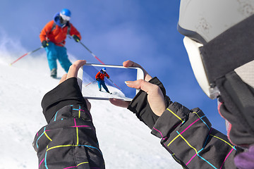 Image showing Photographed skiers with cell phone