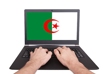 Image showing Hands working on laptop, Algeria