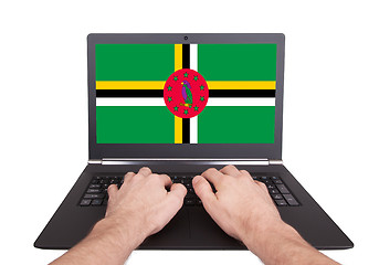 Image showing Hands working on laptop, Dominica