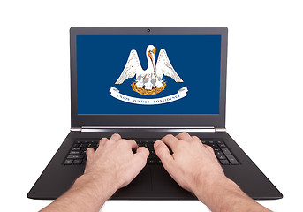 Image showing Hands working on laptop, Louisiana