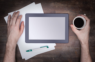 Image showing Tablet touch computer gadget on wooden table