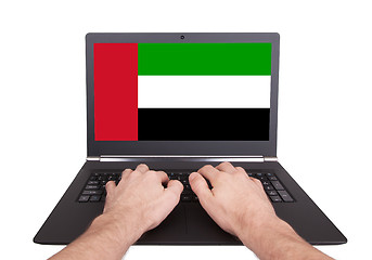 Image showing Hands working on laptop, UAE