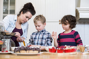 Image showing Family Preparing Cupcake