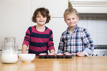 Image showing Smiling children Preparing Cupcake In Kitchen