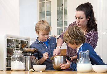 Image showing Family Mixing Cupcake Batter In Kitchen