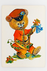 Image showing Reproduction of antique postcard shows bear dressed in tradition