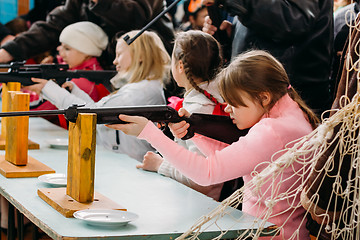 Image showing Unrecognizable Belarusian secondary school pupils girl shooting