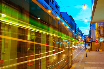 Image showing Tram departs from a stop on street Aleksanterinkatu in Helsinki