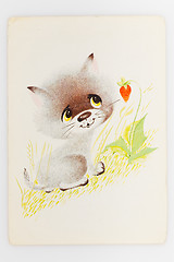 Image showing Reproduction of antique postcard shows gray kitten standing near