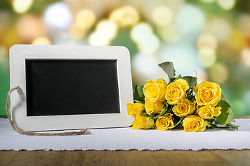 Image showing blank slate blackboard and roses