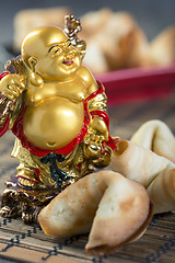 Image showing Laughing Buddha and the Chinese cookies.