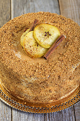 Image showing Cake with cinnamon, apples and caramel cream.