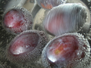 Image showing  plums in the mineral water