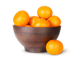 Image showing Tangerines In A Ceramic Bowl And One Near