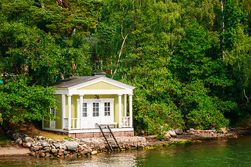 Image showing Yellow Finnish Wooden Bath Sauna Log Cabin On Island In Summer
