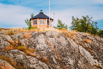 Image showing Yellow Finnish Lookout Wooden House On Island In Summer
