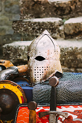 Image showing Protective helmet with a visor on medieval knight