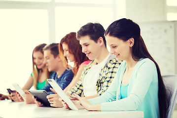 Image showing smiling students with tablet pc at school